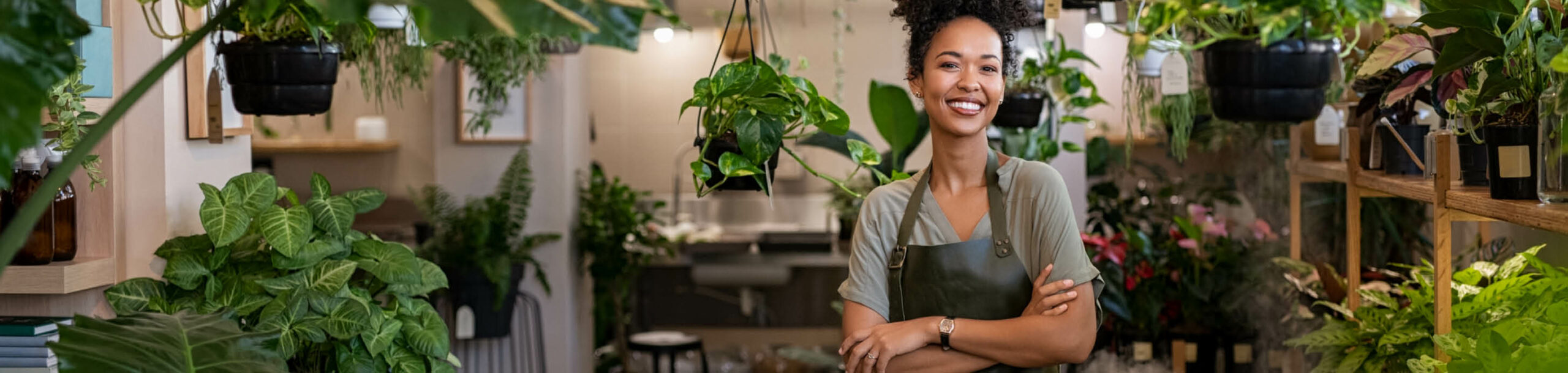 business owner in plant shop - renewable energy