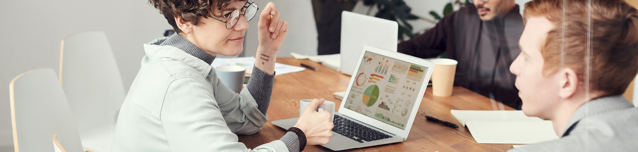 A business team analysing data and discussing the results