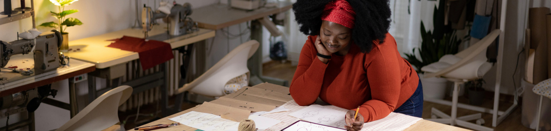 Fashion designer checking out her business energy contract terms and business energy renewal guide