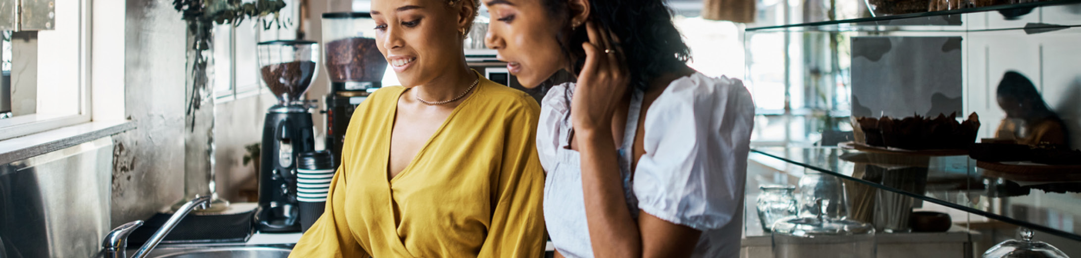 A guide to business energy renewals - two female business owners checking their energy contract