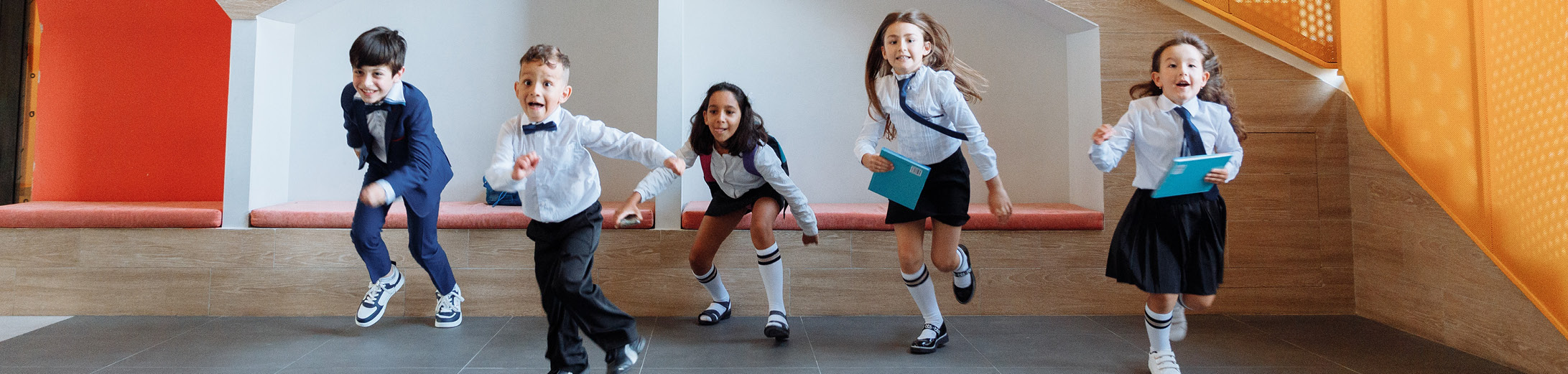 image of young school children jumping and shouting for a back to school marketing campaign