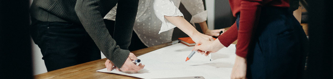 a closeup of a group of people planning black friday for their business