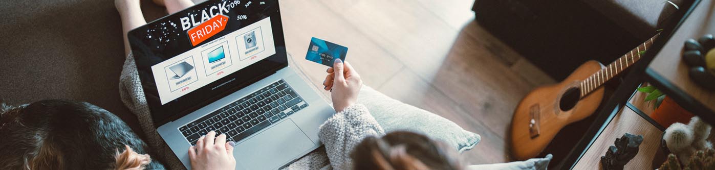 a business advertising black friday to a customer online, who has a payment card in their hand