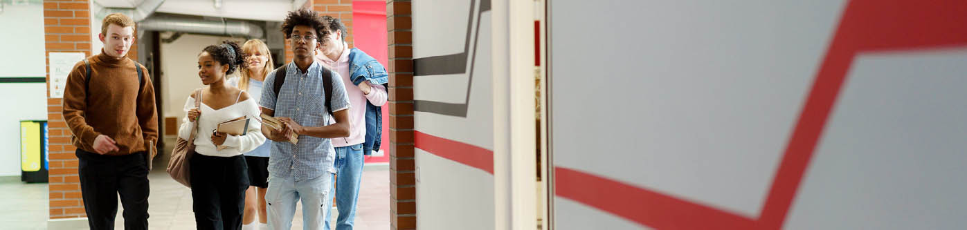 older students walking through school halls