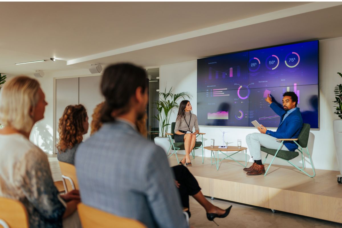 workers watching a presentation on sustainable business practices
